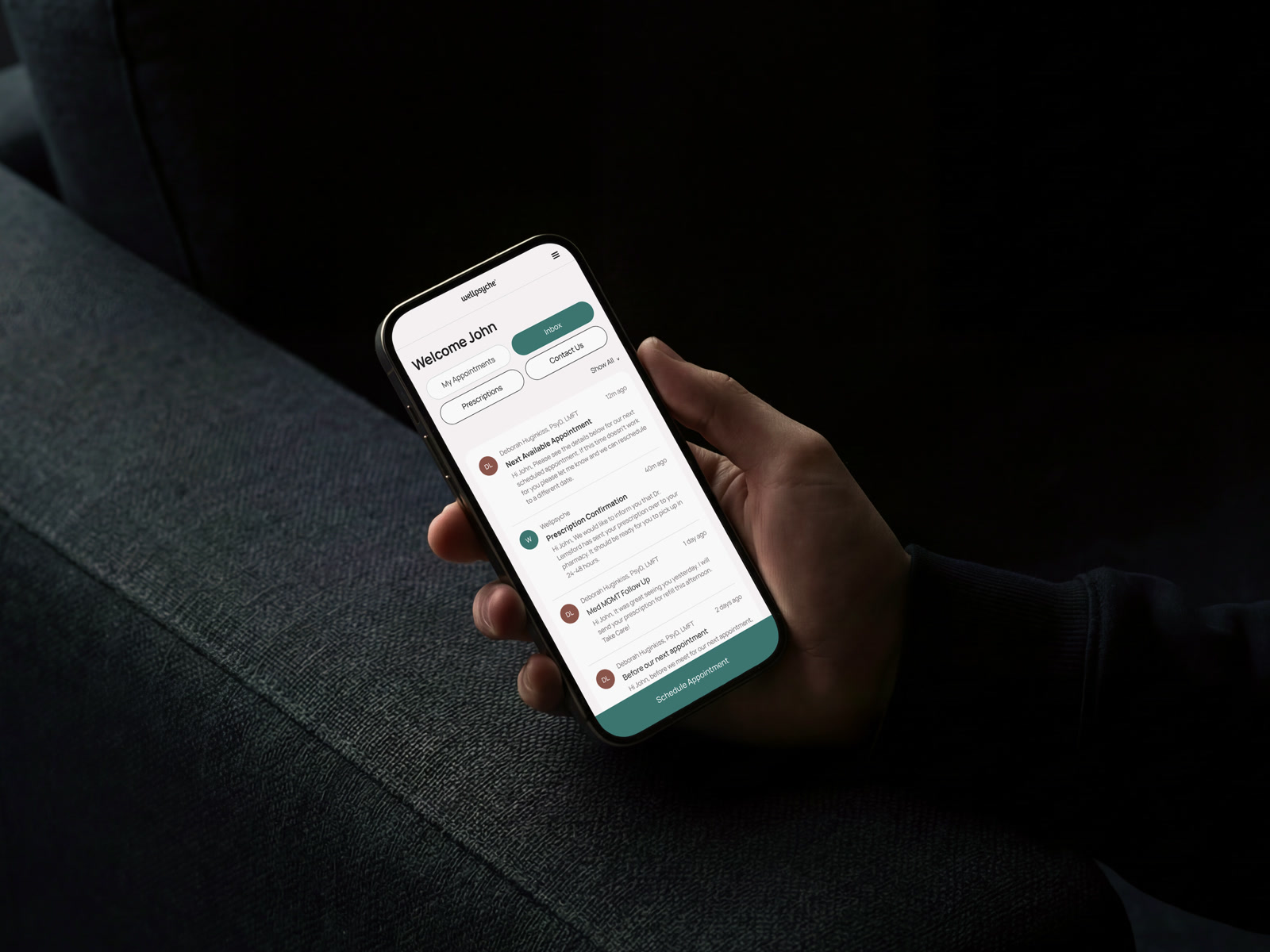 A hand holding a phone showing the WellPsyche Inbox: provider messages, a prescription confirmation, and appointment follow-ups in one list